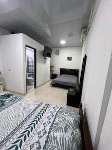 a bedroom with a bed in a room at Habitaciones centrales amobladas in Arauca