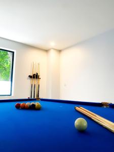 a billiard room with a blue pool table at Keang You Boutique Hotel in Phnom Penh