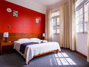 Cama ou camas em um quarto em Novo Bonbini
