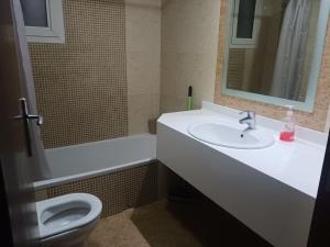 a bathroom with a sink and a toilet at Private room for ladies near metro in Dubai