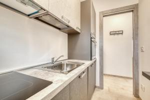 Kuchyň nebo kuchyňský kout v ubytování Lanterne Luxury Apartments + 34 fotografií