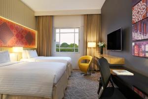 Letto o letti in una camera di Rendezvous Hotel Singapore by Far East Hospitality