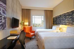 Letto o letti in una camera di Rendezvous Hotel Singapore by Far East Hospitality