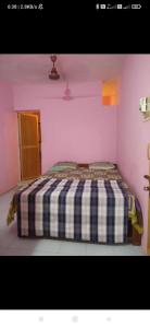 Postel nebo postele na pokoji v ubytování Om Ganesh Naik Guest House