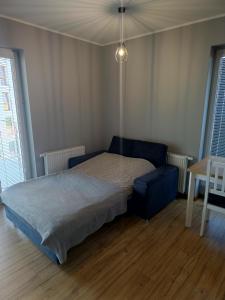 Posteľ alebo postele v izbe v ubytovaní Apartament Perła Kutna