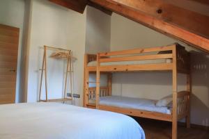 Postel nebo postele na pokoji v ubytování Apartamento dúplex en Sort con piscina