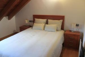Postel nebo postele na pokoji v ubytování Apartamento dúplex en Sort con piscina