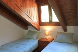 Postel nebo postele na pokoji v ubytování Apartamento dúplex en Sort con piscina
