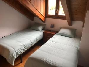 Postel nebo postele na pokoji v ubytování Apartamento dúplex en Sort con piscina