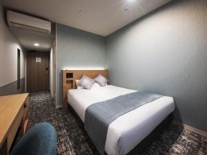 Postel nebo postele na pokoji v ubytování Hotel Villa Fontaine Tokyo-Kayabacho