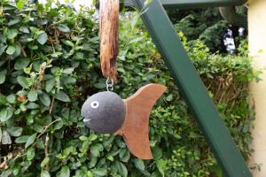 a bird shaped ornament hanging from a wall at Ferienbungalow Thesenvitz in Thesenvitz