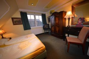 Ένα ή περισσότερα κρεβάτια σε δωμάτιο στο Reethäuser 29 Fam Kröning