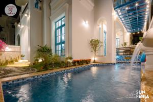 a pool in a hotel with a water slide at Sun Villa 7 br & pool in Ha Long