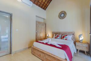 Postel nebo postele na pokoji v ubytování Campuhan Guesthouse