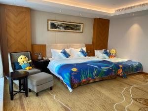Voodi või voodid majutusasutuse Metropolo Jinjiang Yongqing Daxing International Airport Hotel toas
