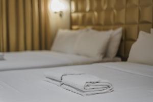 Postel nebo postele na pokoji v ubytování Robertson Hotel