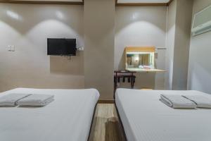 Postel nebo postele na pokoji v ubytování Robertson Hotel + 37 fotografií
