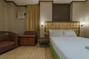 Postel nebo postele na pokoji v ubytování Robertson Hotel