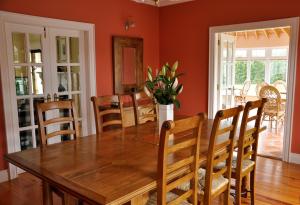 a dining room with a wooden table and chairs at Cherryville House in Portadown +3 photos