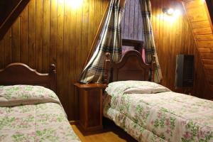 Cama ou camas em um quarto em Cabañas Bosque Del Faldeo