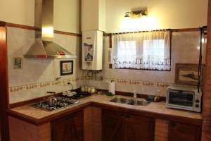 A cozinha ou cozinha compacta de Cabañas Bosque Del Faldeo