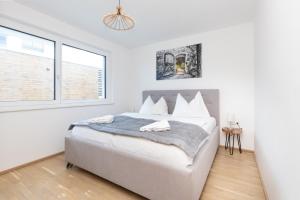 Łóżko lub łóżka w pokoju w obiekcie Apartment SCHLADMING - Neualm center