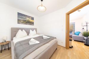 Łóżko lub łóżka w pokoju w obiekcie Apartment SCHLADMING - Neualm center