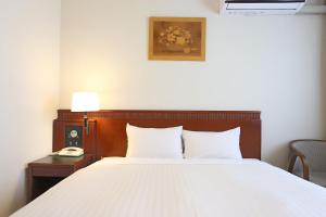 Postel nebo postele na pokoji v ubytování Hotel Castle Inn Suzuka Chuo + 32 fotografií