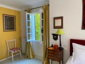 Postel nebo postele na pokoji v ubytování La Bastide Sainte Thérèse