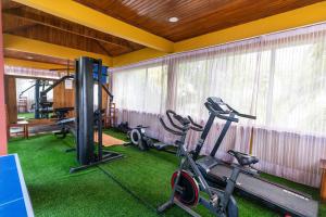 a gym with two treadmills and a treadmill at Golden Hill Parker Hotel in Elmina
