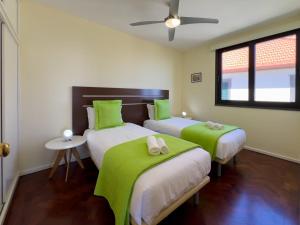 Ένα ή περισσότερα κρεβάτια σε δωμάτιο στο GuestReady - Funchal Sunny Retreat +40 φωτογραφίες