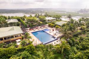 an aerial view of a resort with a swimming pool at Golden Hill Parker Hotel in Elmina