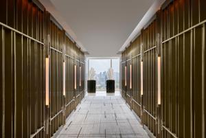 a hallway of a building with a view of the city at Marina Bay Sands in Singapore