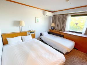 Letto o letti in una camera di Hotel Castle Inn Ise