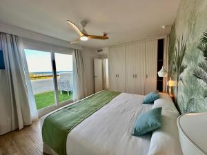 Cama o camas de una habitación en Punta Candor Suites