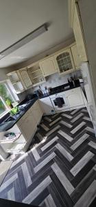 an overhead view of a kitchen with a geometric floor at Contractors Home from Home in South Benfleet