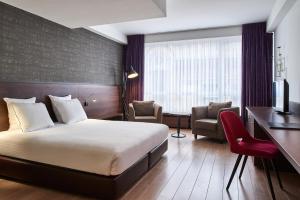 Postel nebo postele na pokoji v ubytování Theater Hotel