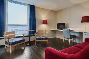 TV a/nebo společenská místnost v ubytování Theater Hotel