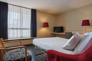 TV a/nebo společenská místnost v ubytování Theater Hotel
