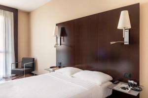 Postel nebo postele na pokoji v ubytování B&B Hotel Arezzo