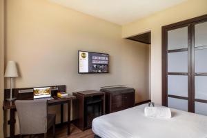 Postel nebo postele na pokoji v ubytování B&B Hotel Arezzo