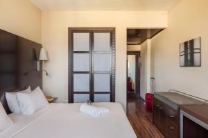 Postel nebo postele na pokoji v ubytování B&B Hotel Arezzo