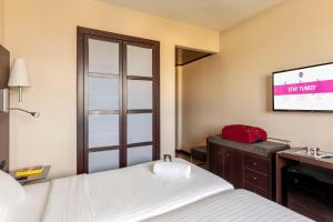 Postel nebo postele na pokoji v ubytování B&B Hotel Arezzo