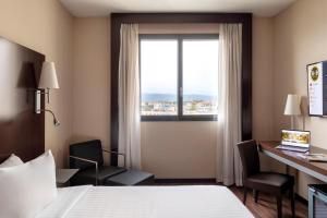 Postel nebo postele na pokoji v ubytování B&B Hotel Arezzo