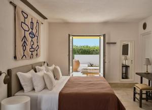 Ein Bett oder Betten in einem Zimmer der Unterkunft Parilio, a Member of Design Hotels