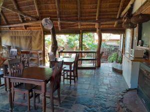 a dining room with a table and chairs at Maroela Gardens Guesthouse in Thabazimbi