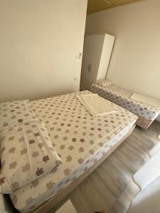 a bedroom with two beds in a room at Göksel Apart in Mersin