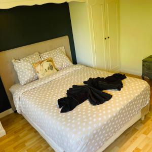 Postel nebo postele na pokoji v ubytování Beau appartement près de la nature entre Disney et Paris