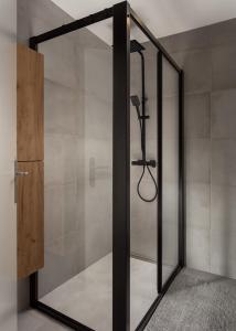 a shower with a glass door in a bathroom at Sunset Beach House in Santa Cruz +26 photos