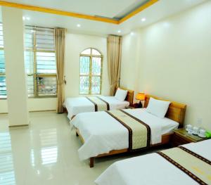 Postel nebo postele na pokoji v ubytování Hotel Đại An An